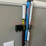 Mini stick holder wall mount for knee hockey sticks, organizing five to ten mini sticks efficiently on a wall.