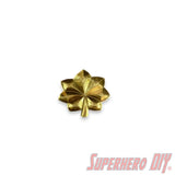 O-4 Major Navy lieutenant commander rank insignia in gold leaf design for military display or collection.