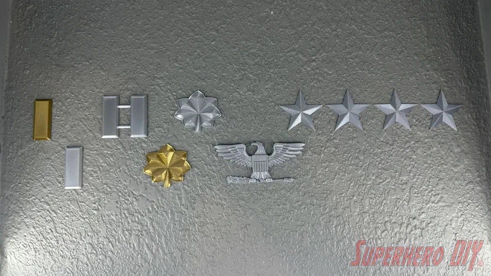 O-4 Major Navy lieutenant commander rank insignia including medals and stars on a reflective surface.