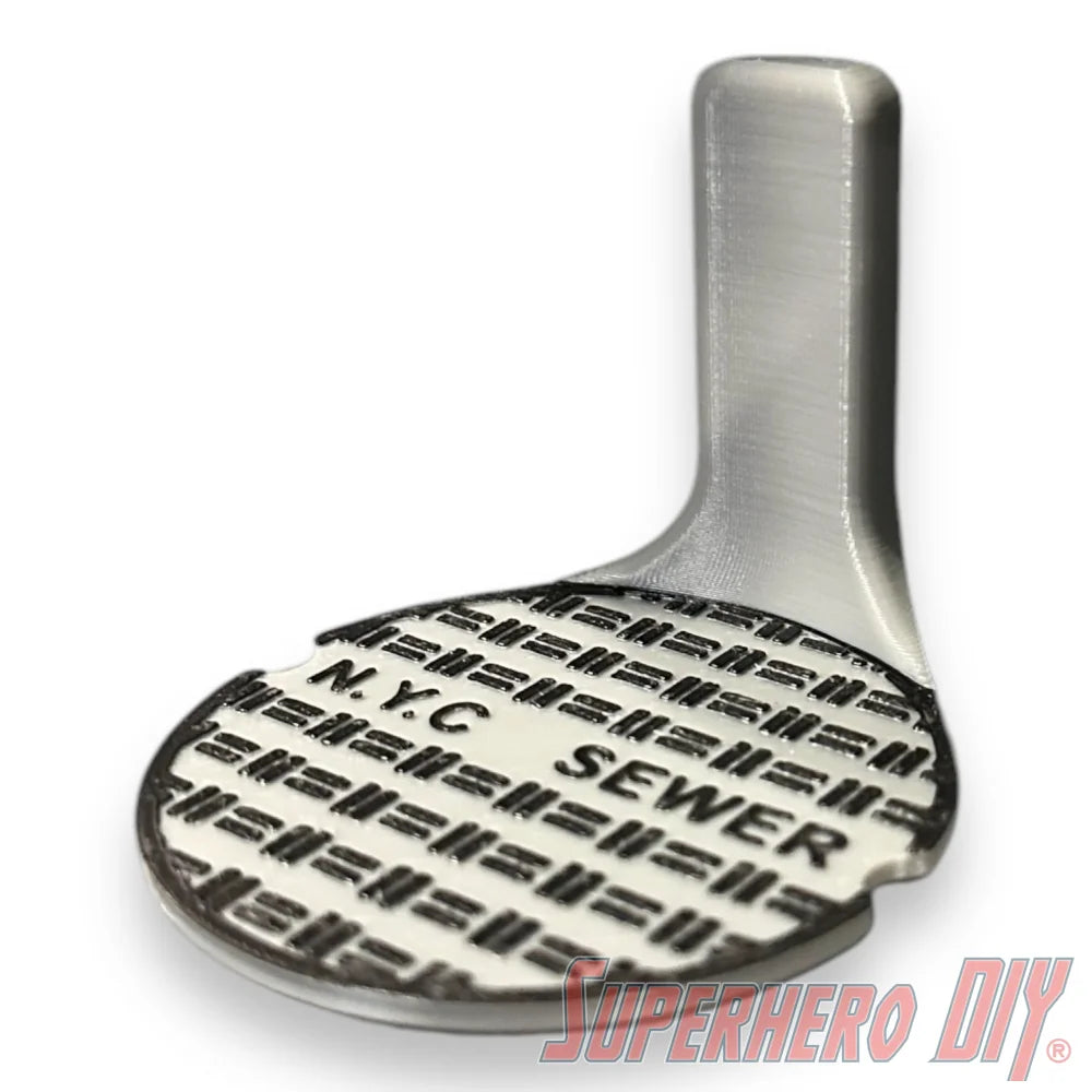 Floating shelf designed to display TMNT action figures and collectibles, styled like a sewer manhole cover for themed wall display