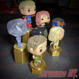 Display riser stands for Funko Pop showcasing colorful figures on raised platforms, enhancing collectible visibility.