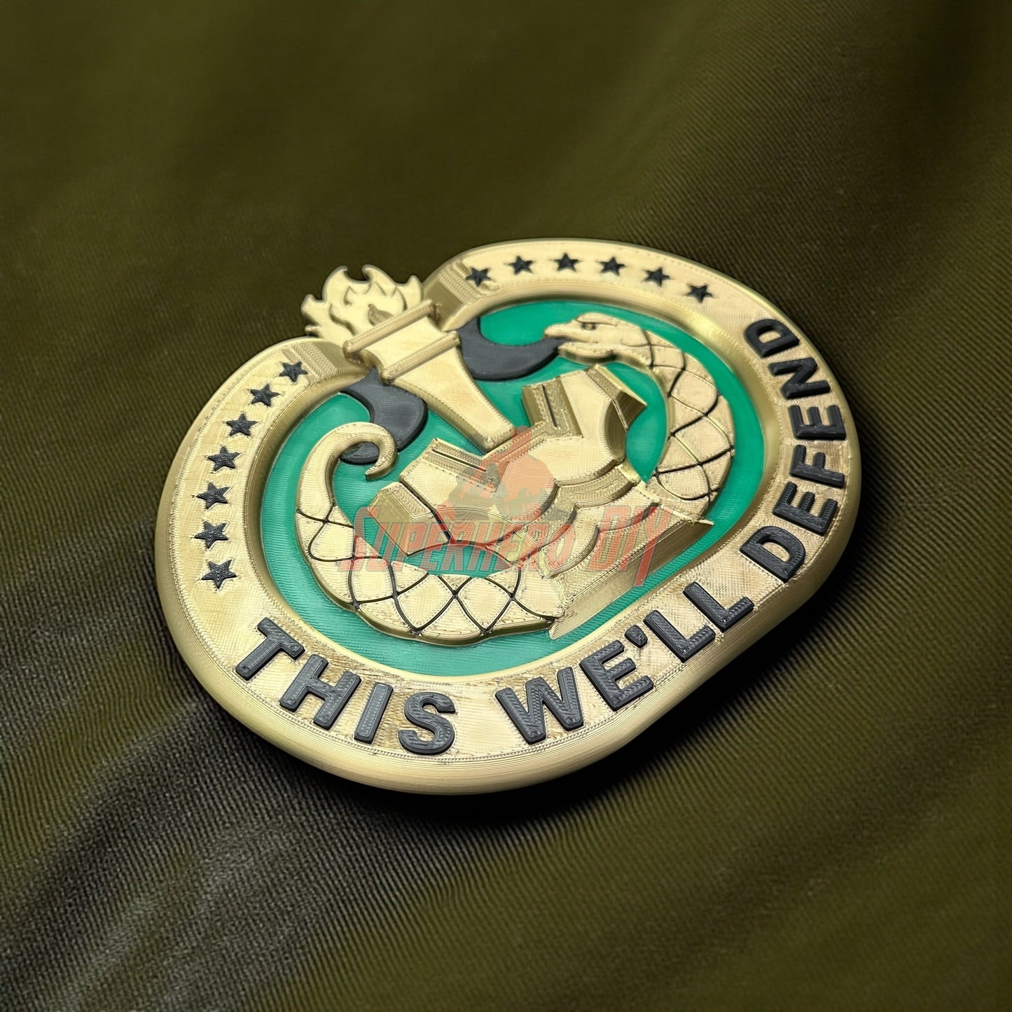 Drill Sergeant Badge Insignia Multiple Sizes for Shadow Box or Wall displayed on a green fabric background.