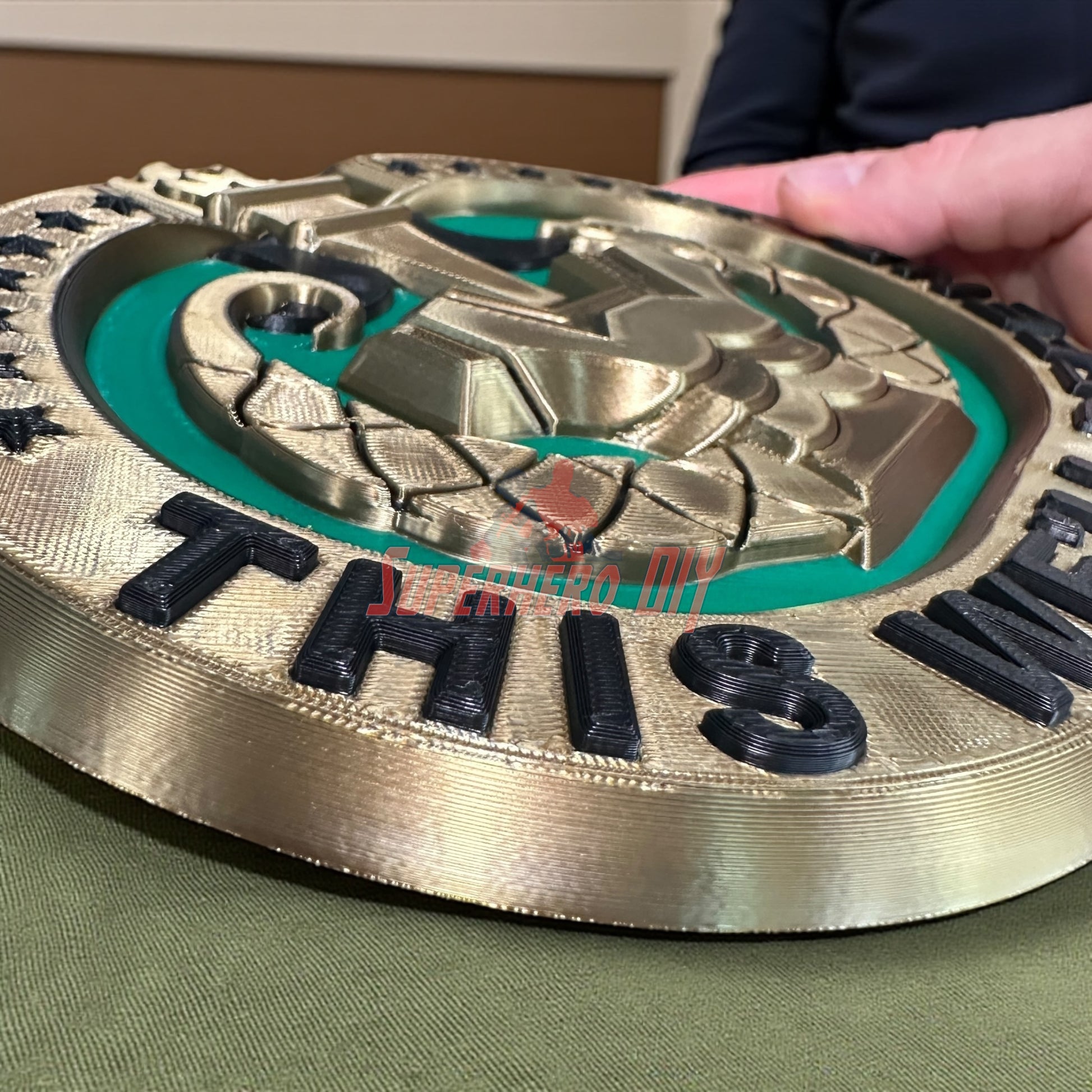 Drill Sergeant Badge Insignia Multiple Sizes for Shadow Box or Wall displayed on green fabric by hand