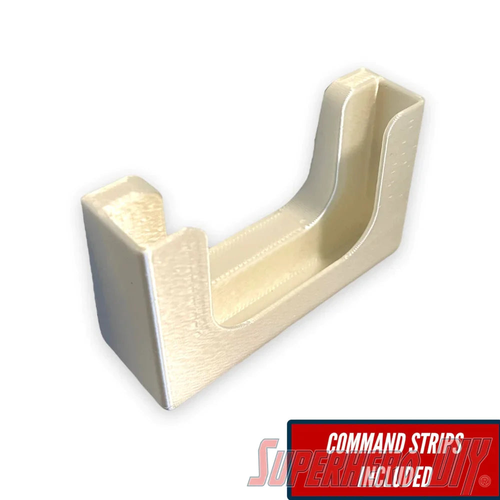 Potty Pocket wall-mounted phone holder with included Command strips for convenient use in the bathroom.