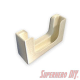 Potty Pocket wall-mounted phone holder in beige, perfect for secure phone storage in bathrooms. Includes Command strips for easy installation.
