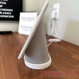 Google Nest Hub Max riser stand on a wooden counter showing angled position for protection from splashes.