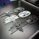 Image of army medical badge display showcasing EFMB, CMB, MCMB in various colors and designs.