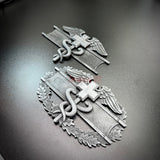 army medical badge display featuring Expert Field Medical Badge and Combat Medical Badge on a dark background.