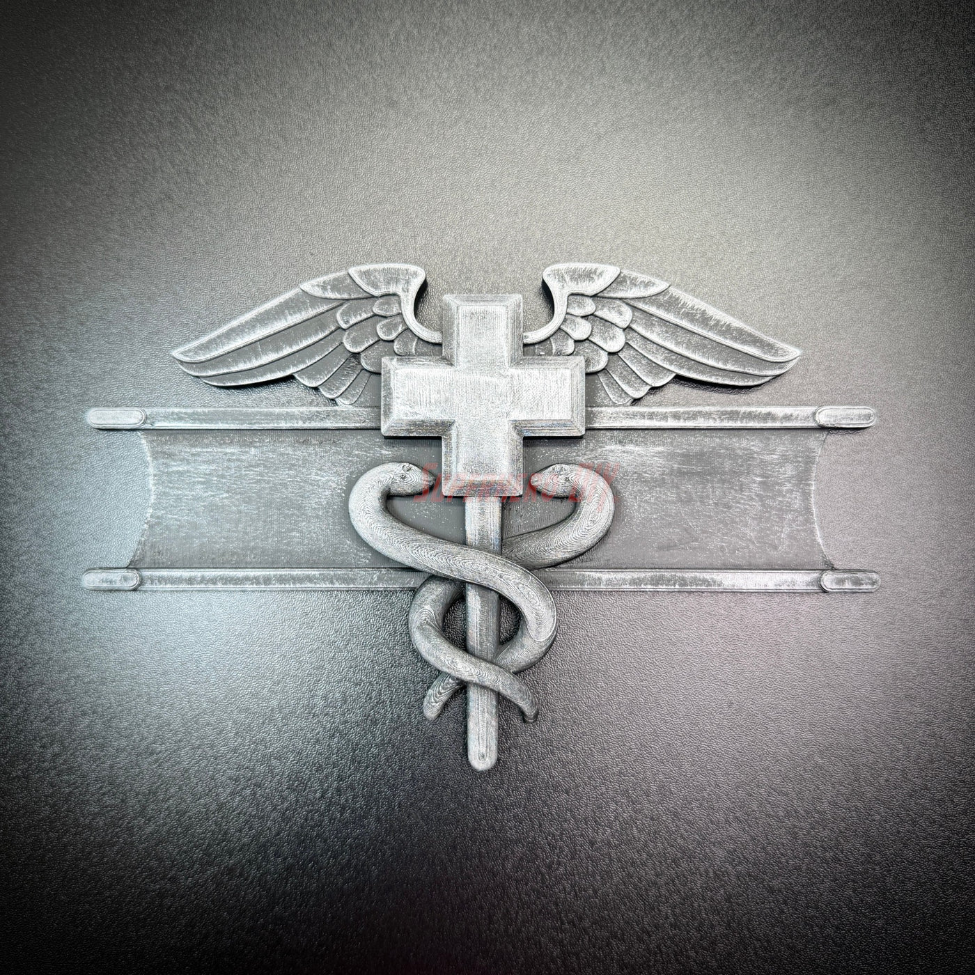 Army medical badge display insignia featuring caduceus and Geneva Convention cross.