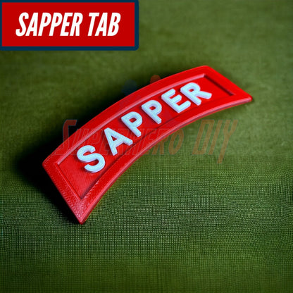 3D sapper tab displayed on a green background, showcasing its red color and white lettering.