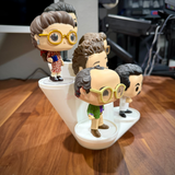 Funko Pop display riser holding a group of vinyl figures at staggered heights