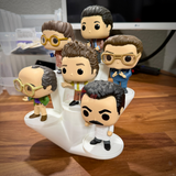 White 6 level crystal display riser holding six Funko Pop figures on staggered platforms