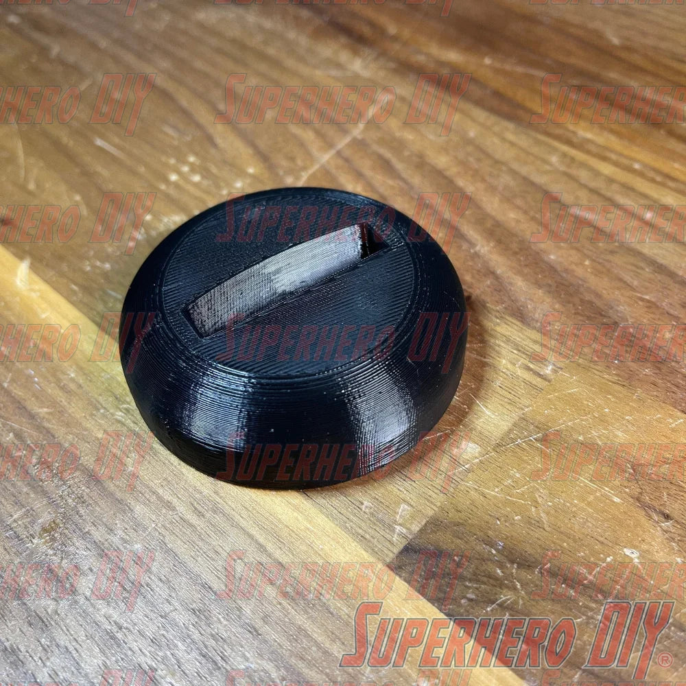 Apple TV Remote Stand 3D-printed holder on wooden table, solves lost remote problem by keeping Apple TV Siri Remote upright and accessible.