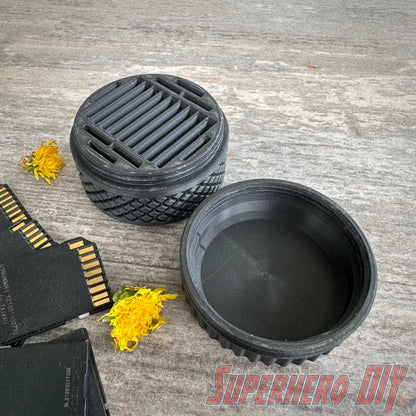 Durable SD card travel case with tire tread design, provides rugged protection and organized storage for memory cards while traveling
