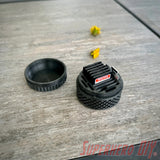 Durable SD card travel case with tire tread design, provides rugged protection and organized storage for memory cards while traveling