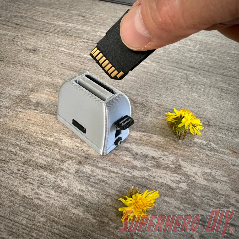 Mini toaster-shaped SD card holder that stores 2 memory cards and doubles as a fun desktop fidget