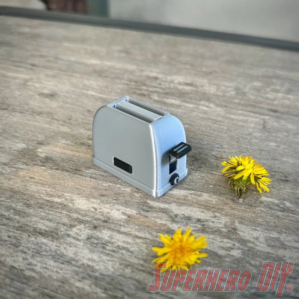 Mini toaster-shaped SD card holder that stores 2 memory cards and doubles as a fun desktop fidget