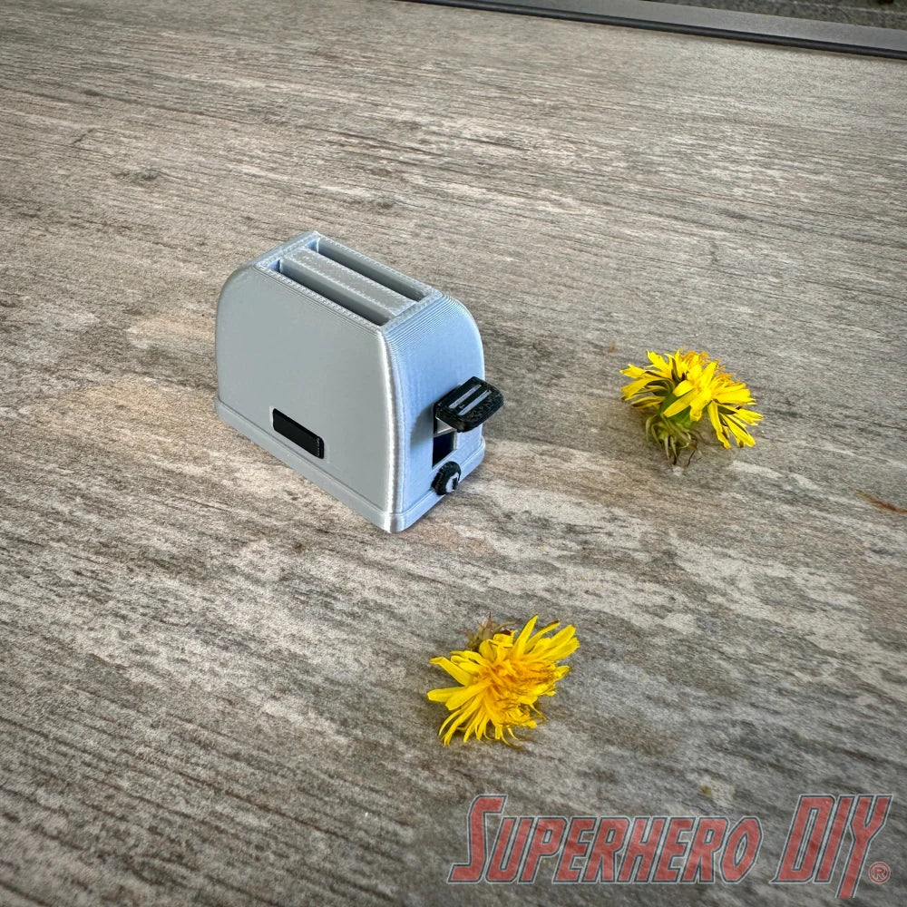 Mini toaster-shaped SD card holder that stores 2 memory cards and doubles as a fun desktop fidget