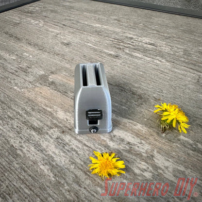 Mini toaster-shaped SD card holder that stores 2 memory cards and doubles as a fun desktop fidget