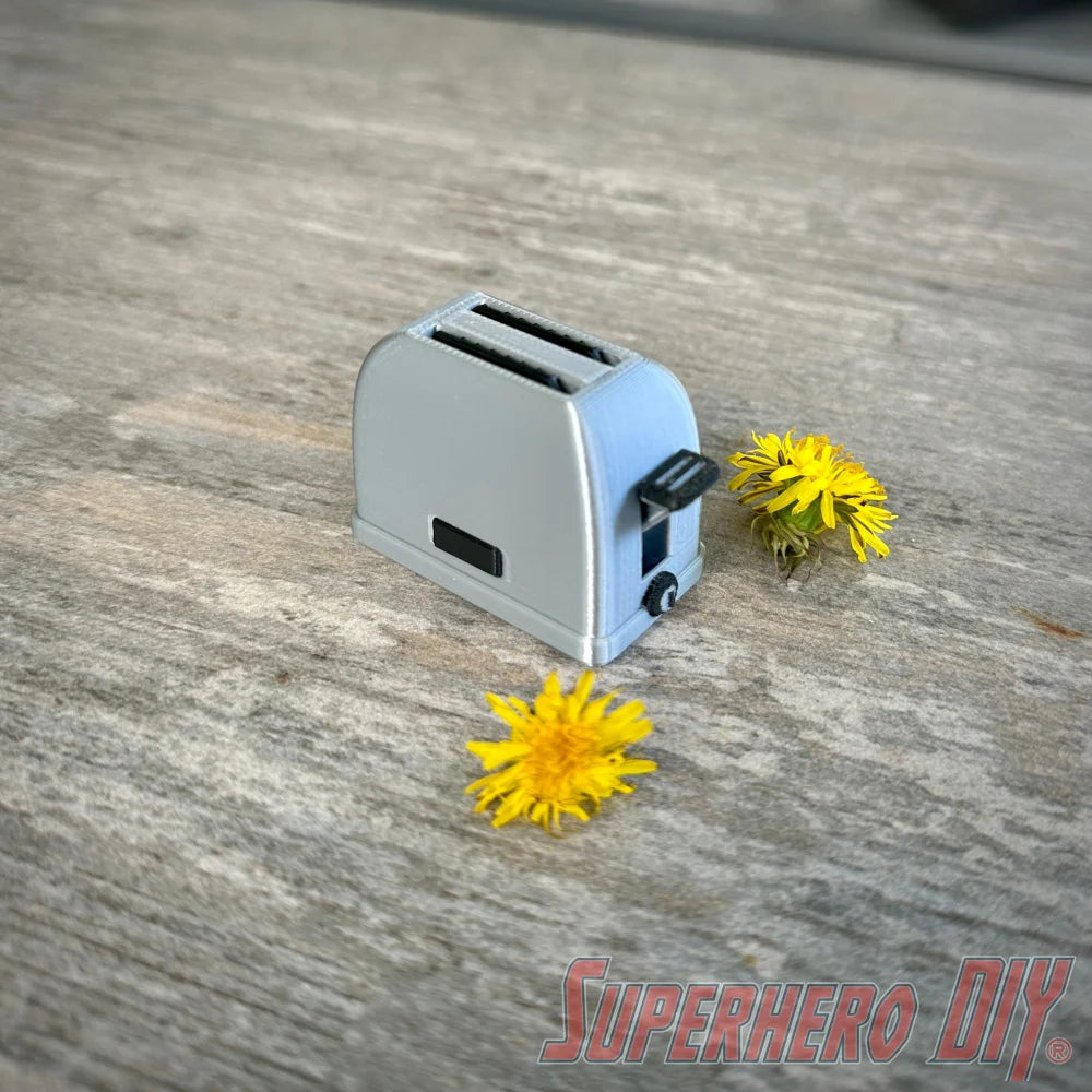 Mini toaster-shaped SD card holder that stores 2 memory cards and doubles as a fun desktop fidget