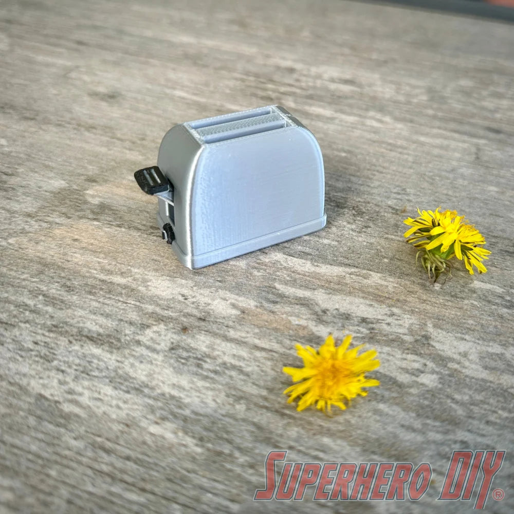 Mini toaster-shaped SD card holder that stores 2 memory cards and doubles as a fun desktop fidget