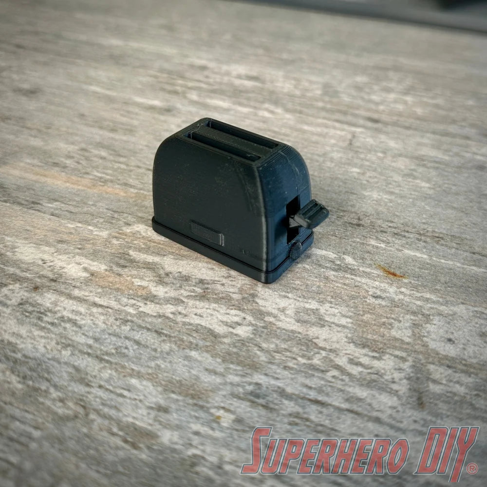 Mini toaster-shaped SD card holder that stores 2 memory cards and doubles as a fun desktop fidget