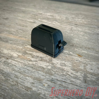 Mini toaster-shaped SD card holder that stores 2 memory cards and doubles as a fun desktop fidget