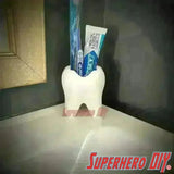Tooth shaped bathroom organizer with toothbrush and toothpaste, perfect for adding personality to your bathroom countertop.