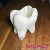 Tooth shaped bathroom organizer for holding toothbrushes, toothpaste. Perfect quirky bathroom decor.