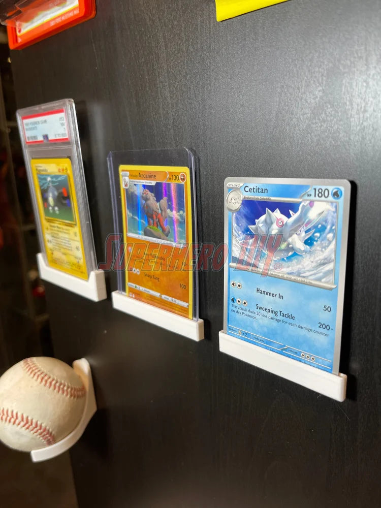trading card wall mounts displaying PSA and CGC graded cards