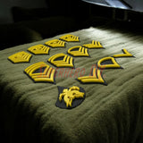 Army enlisted rank insignia displayed in yellow, showcasing various ranks for military tribute or decoration.