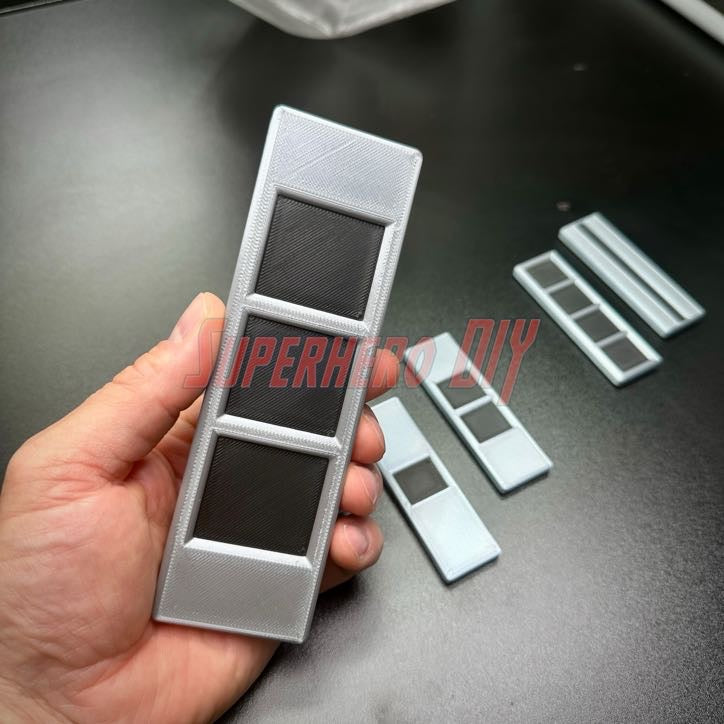 3D replica of US Army Warrant Officer Rank Insignia in hand, showcasing multiple sizes available, in Army colors of black and silver.