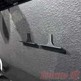Floating shelf for movies or video games installed on wall with Command strip, ideal for Blu-rays and games display.