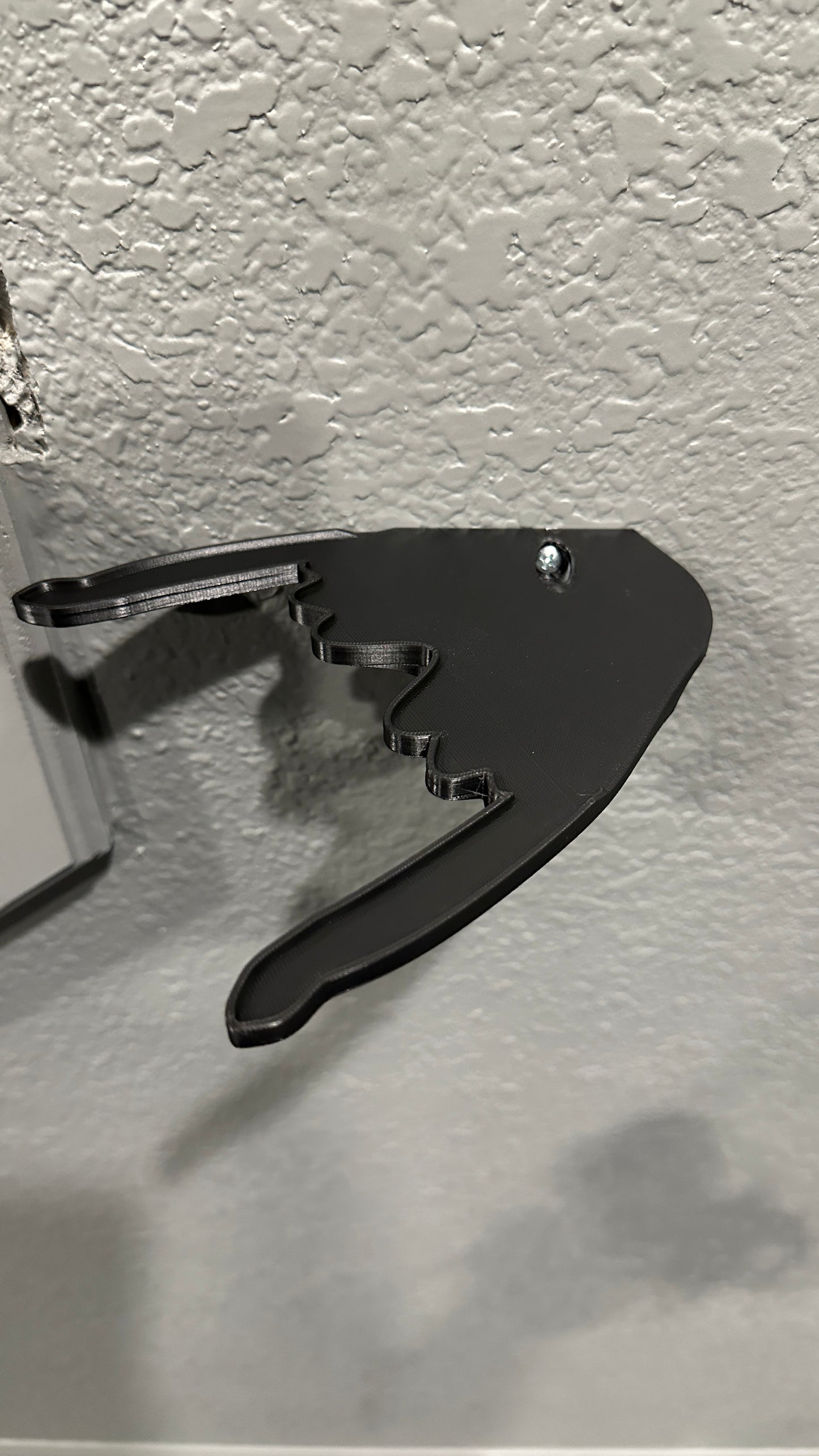 Black wall mount bracket with dragon wing design for displaying POP! Rides figures. - SuperheroDIY