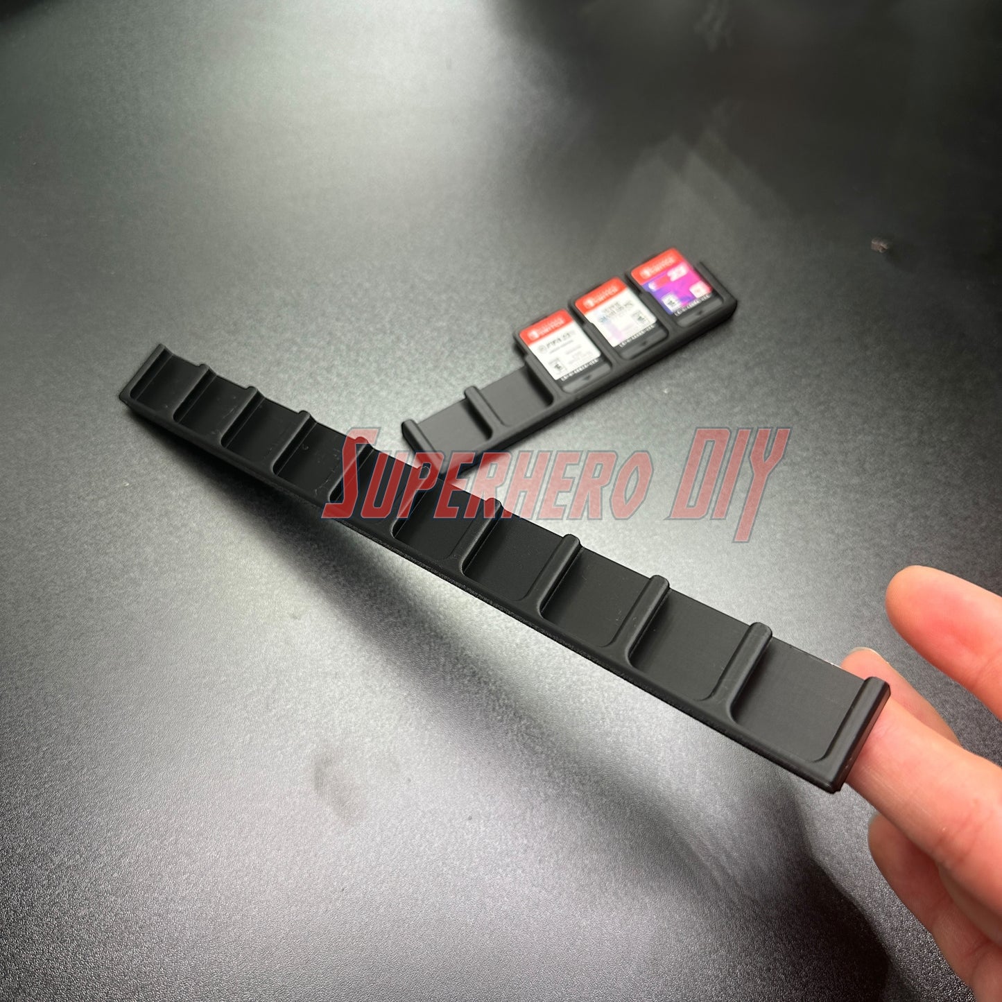 Game Cartridge Holder for Nintendo Switch – 5 or 10 Slot Display Rack showcasing slots and game cartridges on a desk.