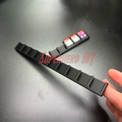 Game Cartridge Holder for Nintendo Switch – 5 or 10 Slot Display Rack showcasing slots and game cartridges on a desk.