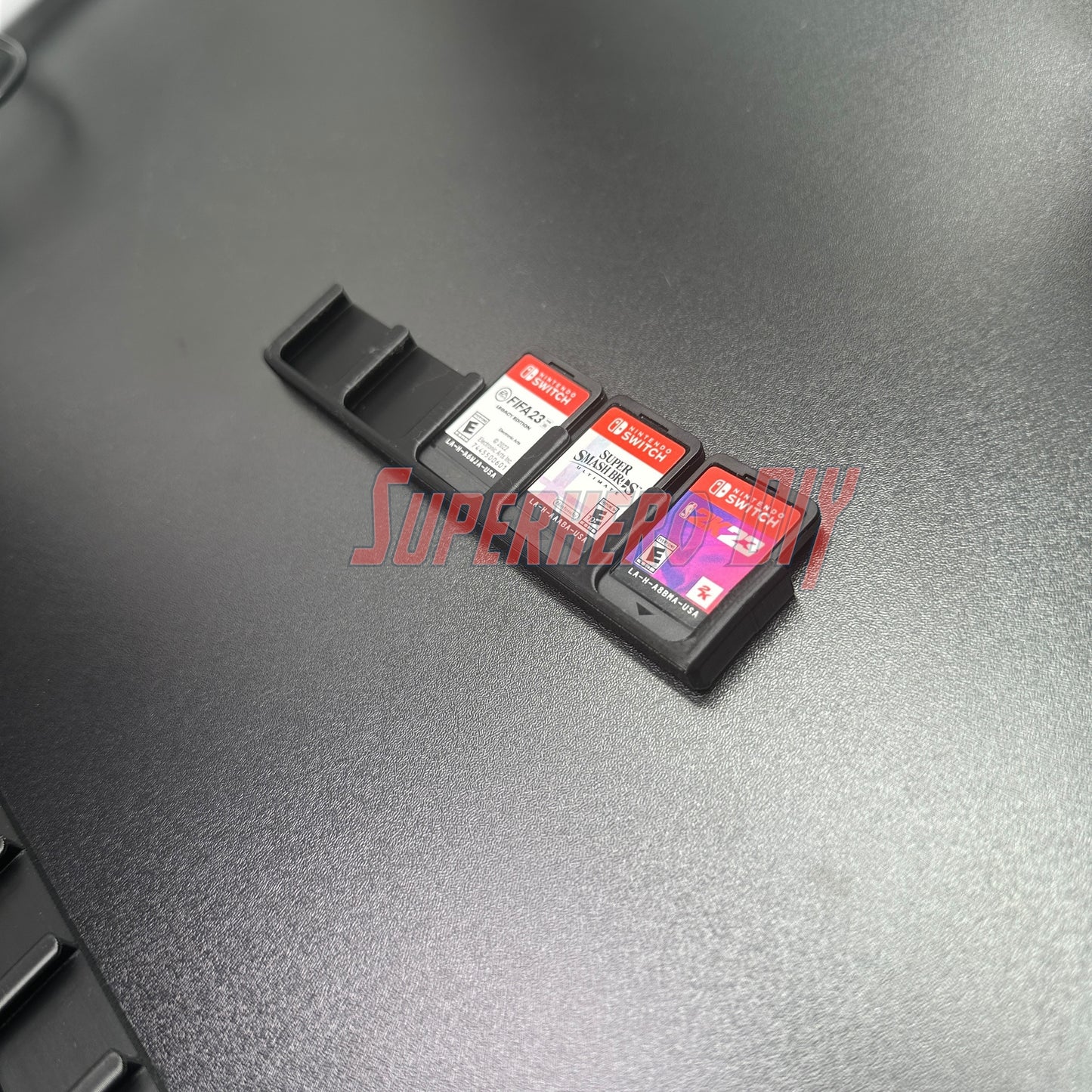 Game Cartridge Holder for Nintendo Switch – 5 or 10 Slot Display Rack with game cartridges on a black surface.