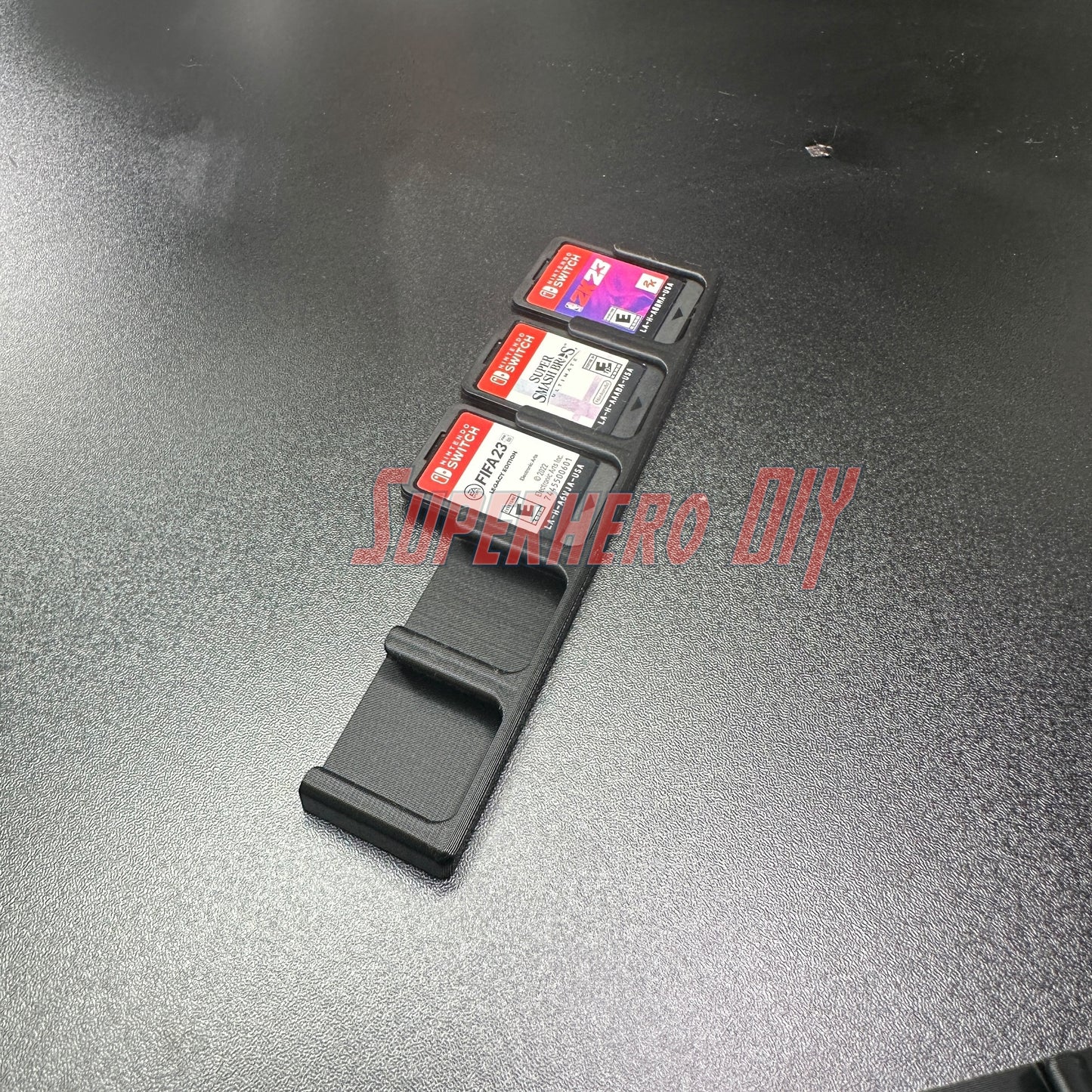 Game Cartridge Holder for Nintendo Switch – 5 or 10 Slot Display Rack with game cartridges displayed on a black surface.