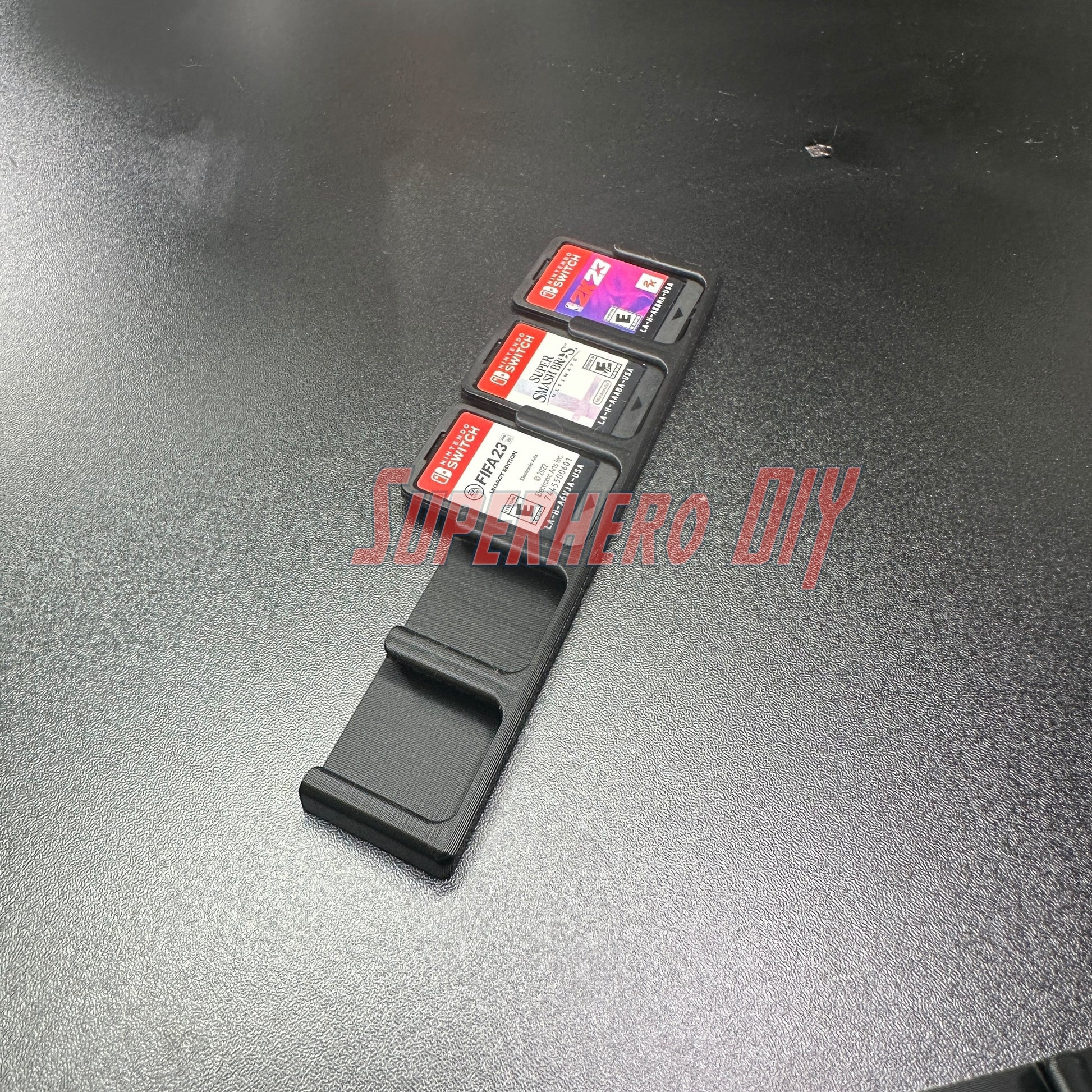 Game Cartridge Holder for Nintendo Switch – 5 or 10 Slot Display Rack with game cartridges displayed on a black surface.
