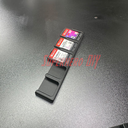Game Cartridge Holder for Nintendo Switch – 5 or 10 Slot Display Rack with game cartridges displayed on a black surface.