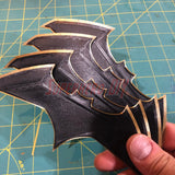 Set of BvS JL batarang prop in black with gold trim, ideal for cosplay or costumes, made from eco-friendly PLA plastic.