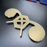 Chemical Corps insignia displayed on a flat surface, showcasing its detailed gold design and craftsmanship.