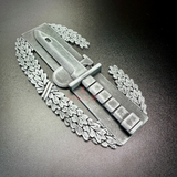 Combat Action Badge display insignia featuring a bayonet and oak wreath on a dark background.
