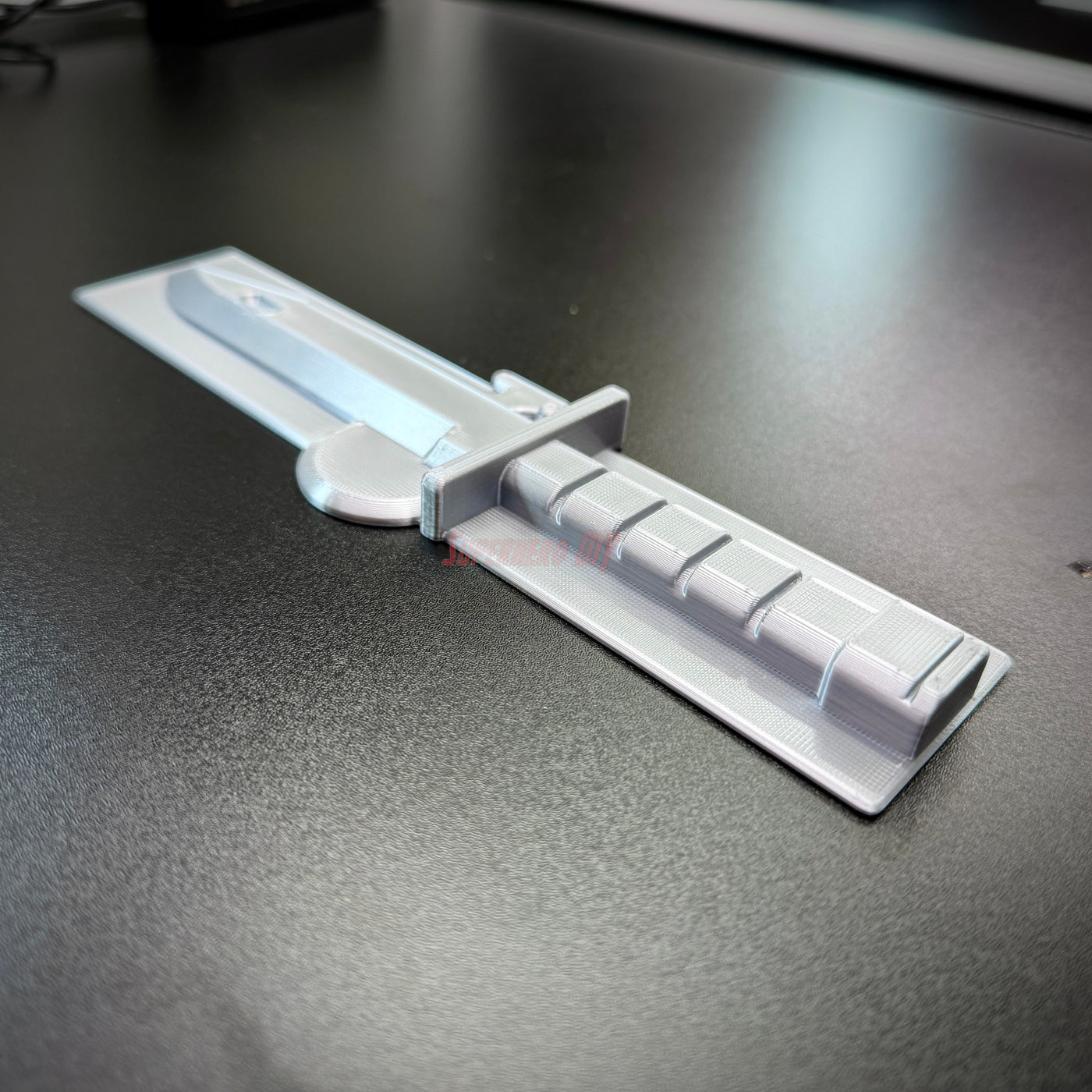 Expert Soldier Badge display with a replica M9 bayonet on a sleek surface, showcasing expert soldier badge detail.