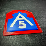 Low angle of the Fifth Army insignia display on dark stone, showing the depth of the red border and blue mosque