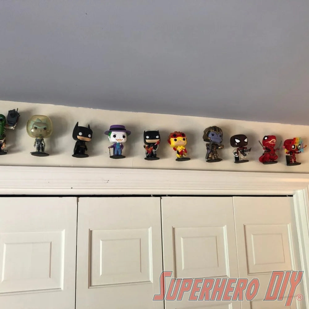 Funko Pop collection displayed on Superhero DIY floating figure shelves, creating an organized wall-mounted display for collectibles