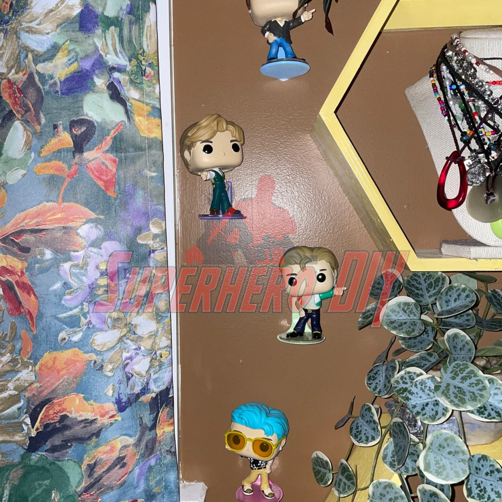 floating shelves for funko pops displaying superhero figures
