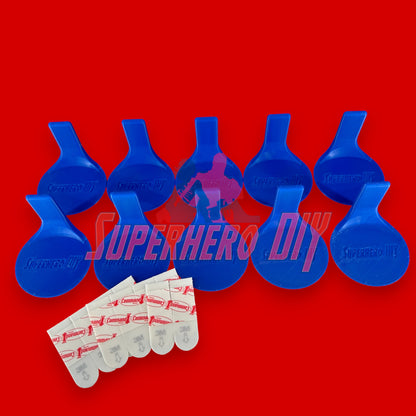 Superhero DIY floating shelves for Funko Pops with adhesive strips, perfect for displaying collectibles on a red background.