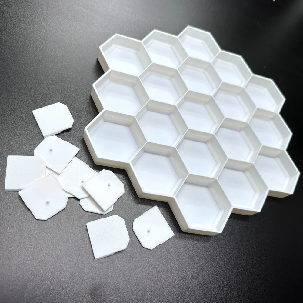 3D-printed honeycomb display for 19 Disney Doorables, showcasing empty hexagonal slots on a black surface.