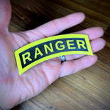 3D Army Ranger tab displayed in hand, featuring the iconic yellow and black design.